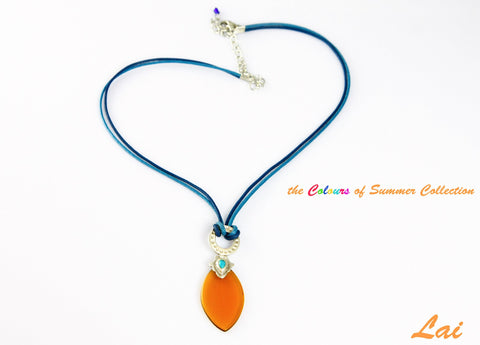 Artistic, navette shape amber colour glass pendant on contrasting blue cord - Lai