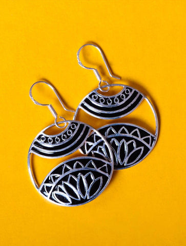 Beautiful, artistic, round dangling earrings with fine black enamel work - Lai