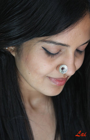 Big, round, textured nose pin with garnet center - Lai