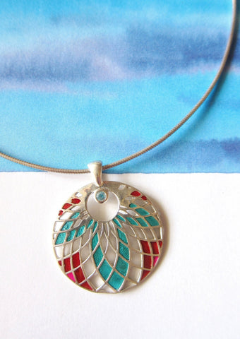 Exquisite, jali cut-out pattern round enamel pendant