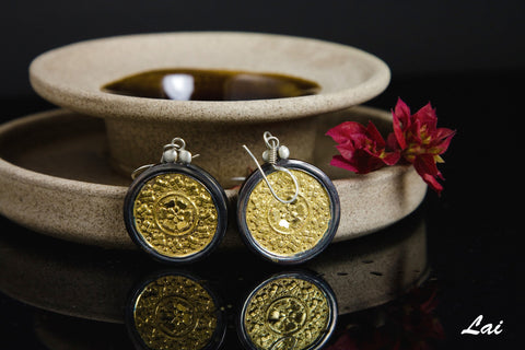 Elegant, Thappa (stamped) round gold-plated earrings with oxidized silver frame  Earrings Sterling silver handcrafted jewellery. 925 pure silver jewellery. Earrings, nose pins, rings, necklaces, cufflinks, pendants, jhumkas, gold plated, bidri, gemstone jewellery. Handmade in India, fair trade, artisan jewellery.