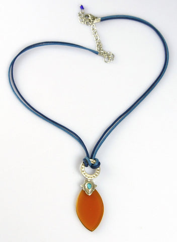 Artistic, navette shape amber colour glass pendant on contrasting blue cord