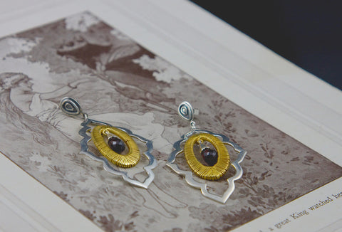 Beautiful, moroccan cut-out earrings with gold plated wire wrapping detail and a faceted garnet drop  Earrings Sterling silver handcrafted jewellery. 925 pure silver jewellery. Earrings, nose pins, rings, necklaces, cufflinks, pendants, jhumkas, gold plated, bidri, gemstone jewellery. Handmade in India, fair trade, artisan jewellery.