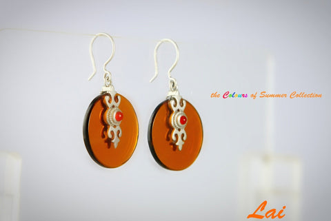 Chic and unique, round glass earrings with silver cut-work and carnelian accent