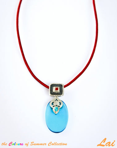Chic, oval blue glass pendant with silver, turquoise and carnelian detailing - Lai