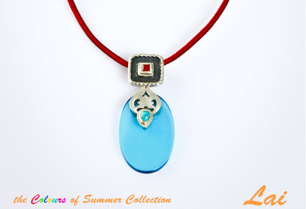 Chic, oval blue glass pendant with silver, turquoise and carnelian detailing - Lai