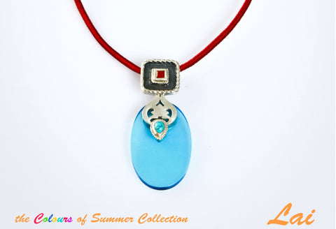 Chic, oval blue glass pendant with silver, turquoise and carnelian detailing