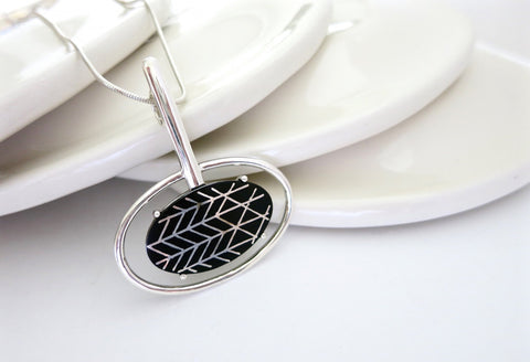 Contemporary, sophisticated oval Bidri pendant