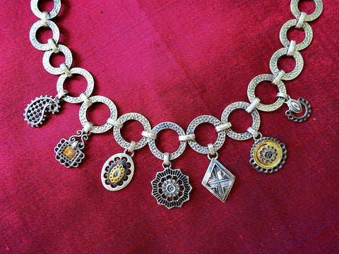 Conversation-starting, mehndi-inspired charms necklace with gold and black rhodium plated detailing - Lai