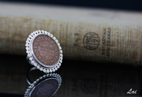 Dramatic, vintage Indian-coin ring with a silver border