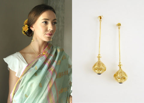Elegant, stylish, gold plated long earrings with filigree work and garnet accent