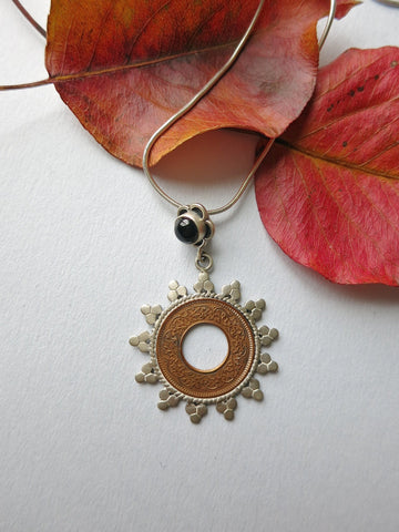 Ethereal vintage coin pendant with onyx accent