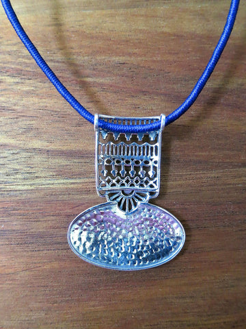 Graceful and artistic, Kutch-inspired, long pendant with hammer finish and intricate jali work - Lai