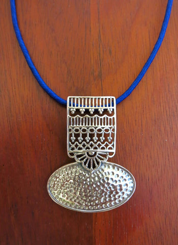 Graceful and artistic, Kutch-inspired, long pendant with hammer finish and intricate jali work - Lai