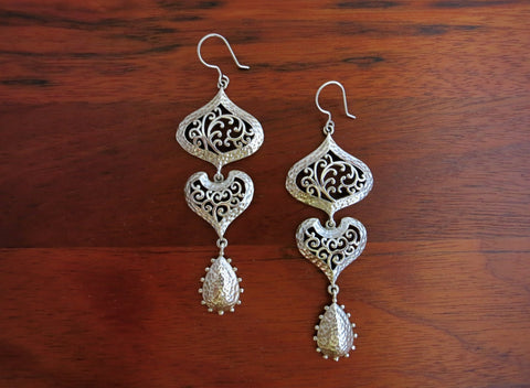 Head-turning, long, 3-tier, Kutch-inspired jali and hammer finish statement earrings