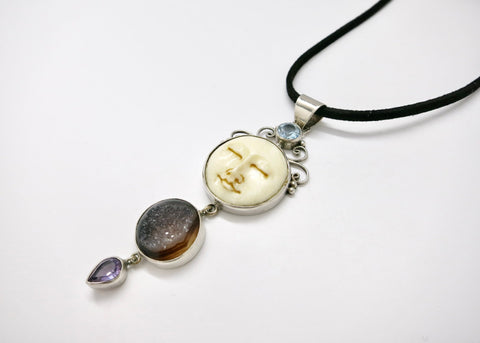 Indonesian carved bone moon-face pendant with druzy, amethyst, and blue topaz - Lai