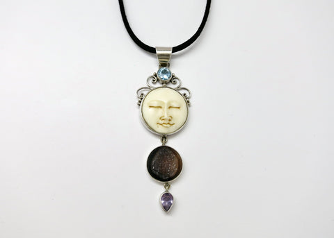 Indonesian carved bone moon-face pendant with druzy, amethyst, and blue topaz