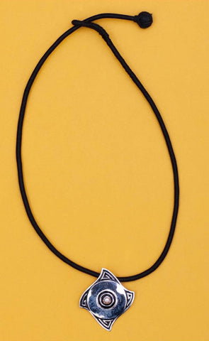 Minimalist, curved diamond shape pendant with a pearl center and fine black enamel work - Lai