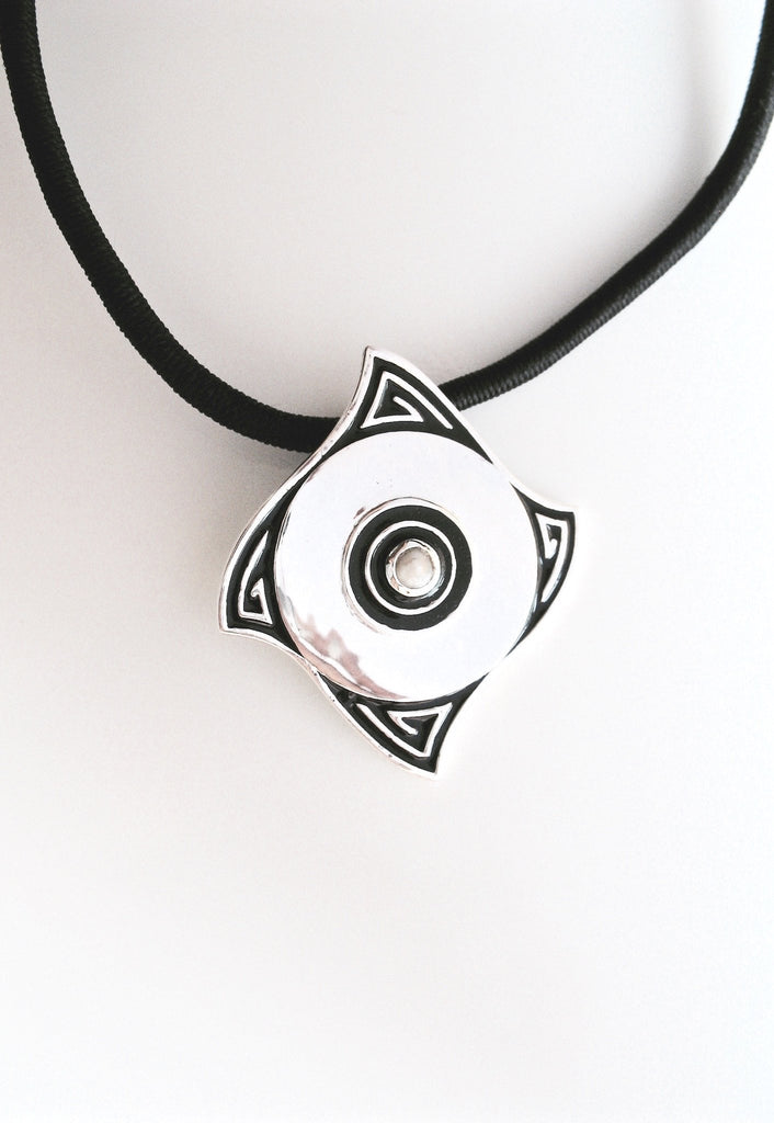 Minimalist, curved diamond shape pendant with a pearl center and fine black enamel work - Lai