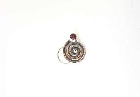 Arresting, spiral nose pin set with a garnet