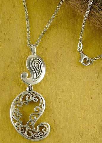 Playful, stunning, double paisley pendant with fine cutout detailing