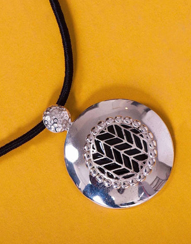 Super chic, round pendant with fine black enamel work center - Lai